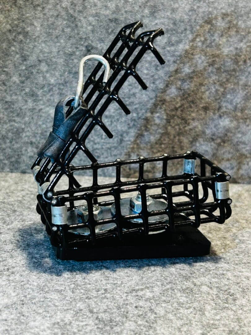 Black metal wire basket holding bolts